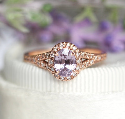 Oval lavender sapphire ring with diamond halo