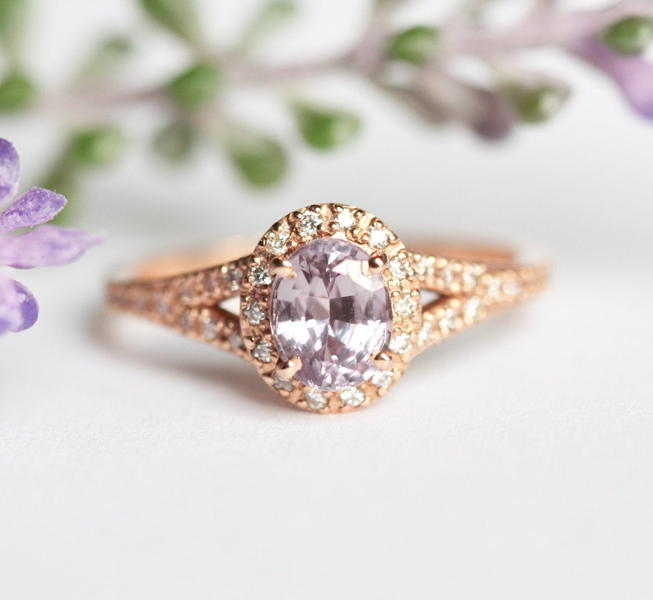 Oval lavender sapphire ring with diamond halo