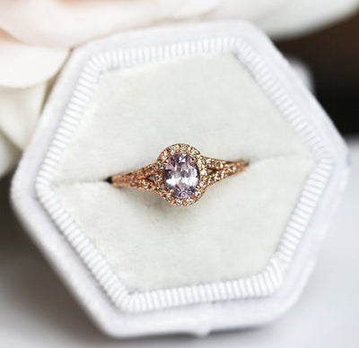 Oval lavender sapphire ring with diamond halo