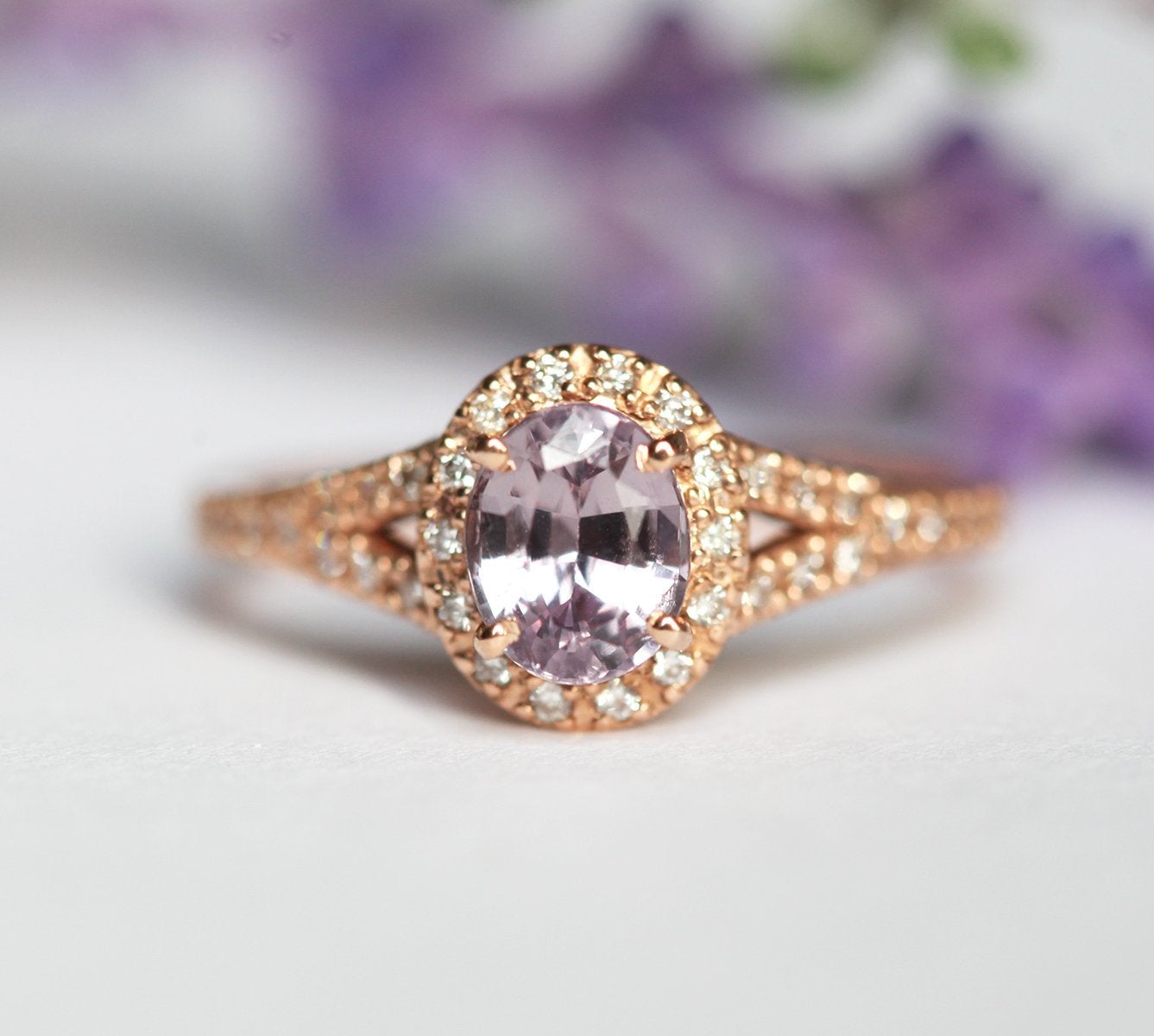 Oval lavender sapphire ring with diamond halo