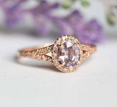 Oval lavender sapphire ring with diamond halo