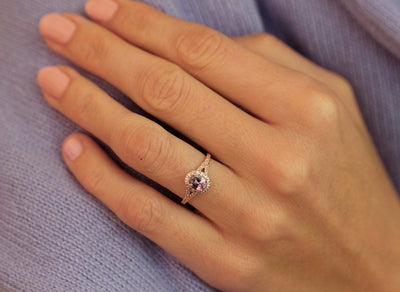 Oval lavender sapphire ring with diamond halo