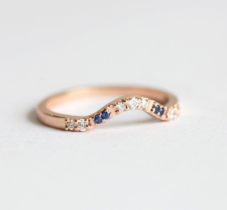 Curved pave diamond and blue sapphire wedding ring
