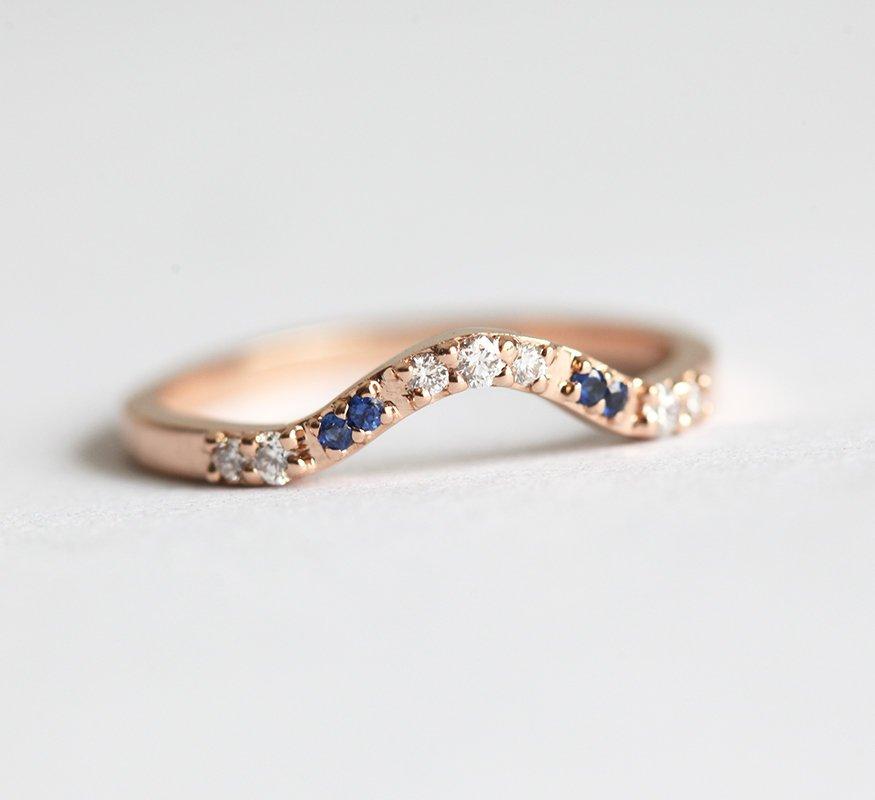 Curved pave diamond and blue sapphire wedding ring
