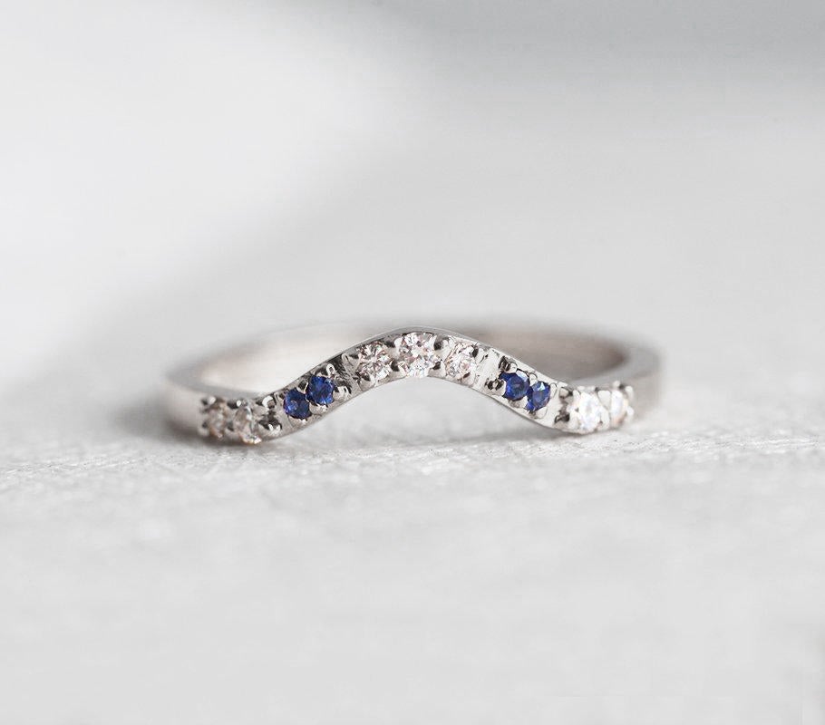 Curved pave diamond and blue sapphire wedding ring