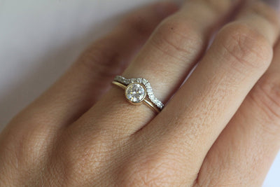 Gold Curved Wedding Band Featuring Pave White Diamonds and main ring