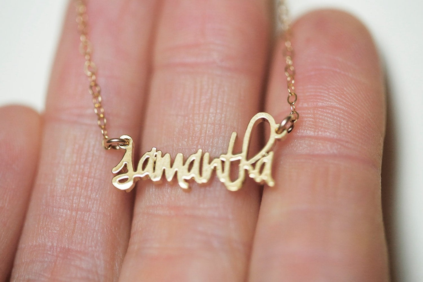 Gold necklace with personalized word