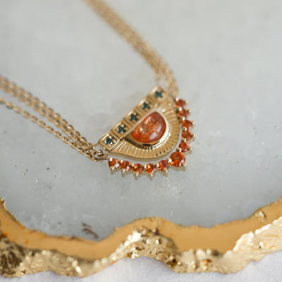 Round blue diamond gold bar necklace, half moon sunstone gold necklace and round orange sapphire curved necklace