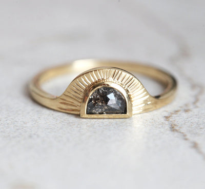 Half-moon-shaped teal sapphire ring