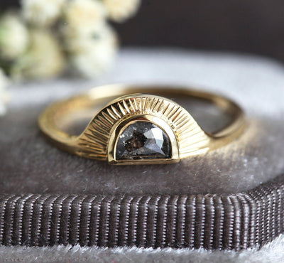 Half-moon-shaped teal sapphire ring