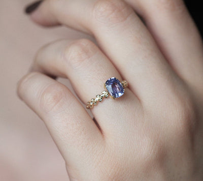 Cushion-cut lavender sapphire ring with side diamonds