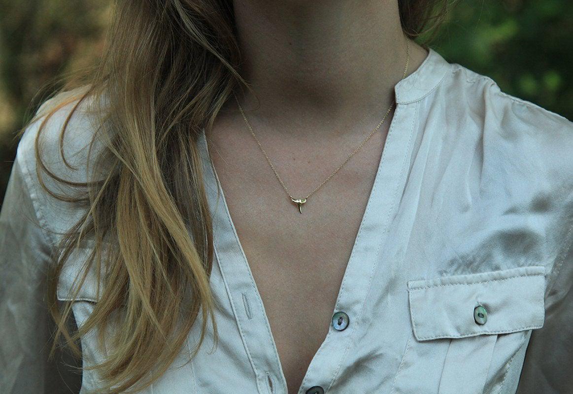 Gold shark tooth necklace