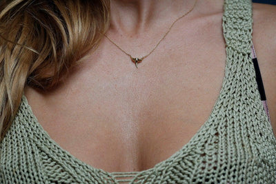 Gold shark tooth necklace