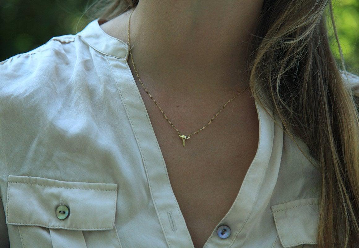 Gold shark tooth necklace