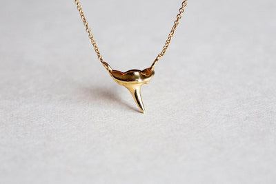 Gold shark tooth necklace