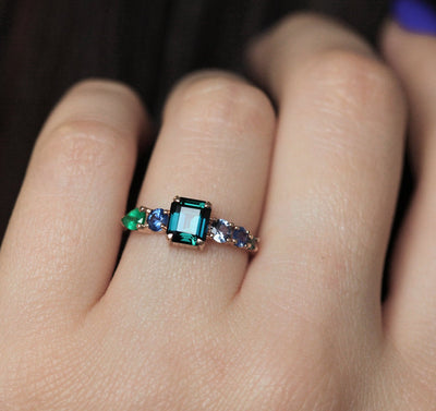 Emerald-shaped sapphire cluster ring with emeralds