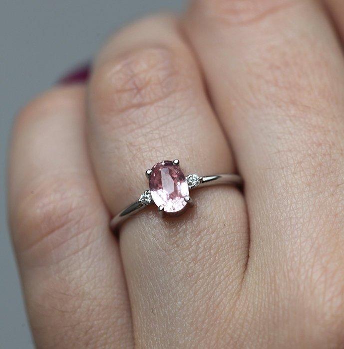 Oval peach sapphire ring with side diamonds