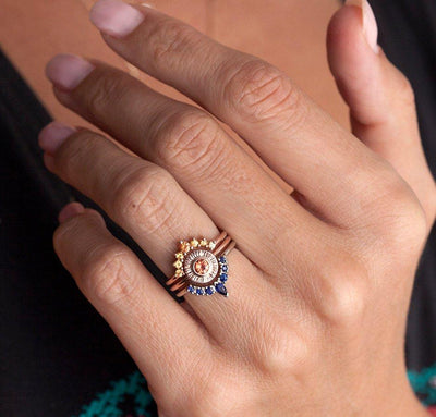 Round orange sapphire ring
