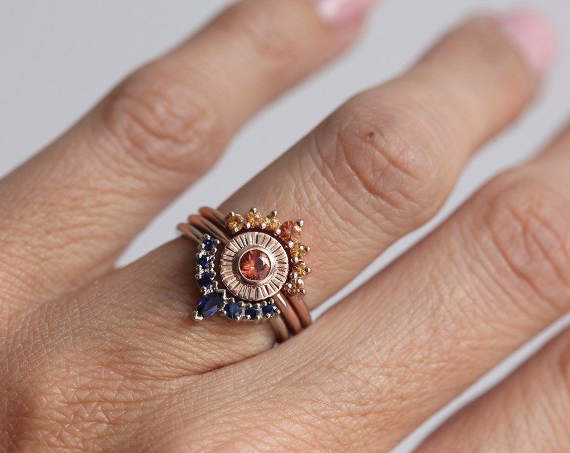 Round orange sapphire ring