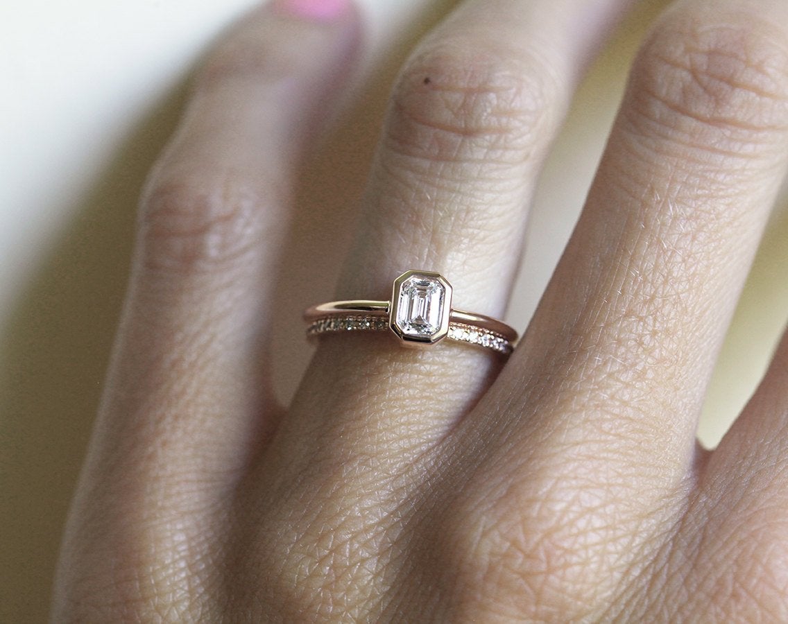 Emerald-Cut White Diamond Solitaire Gold Ring with complementary ring