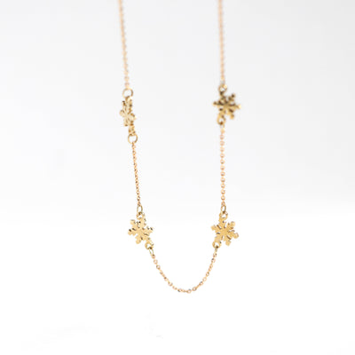 Gold snowflake station necklace