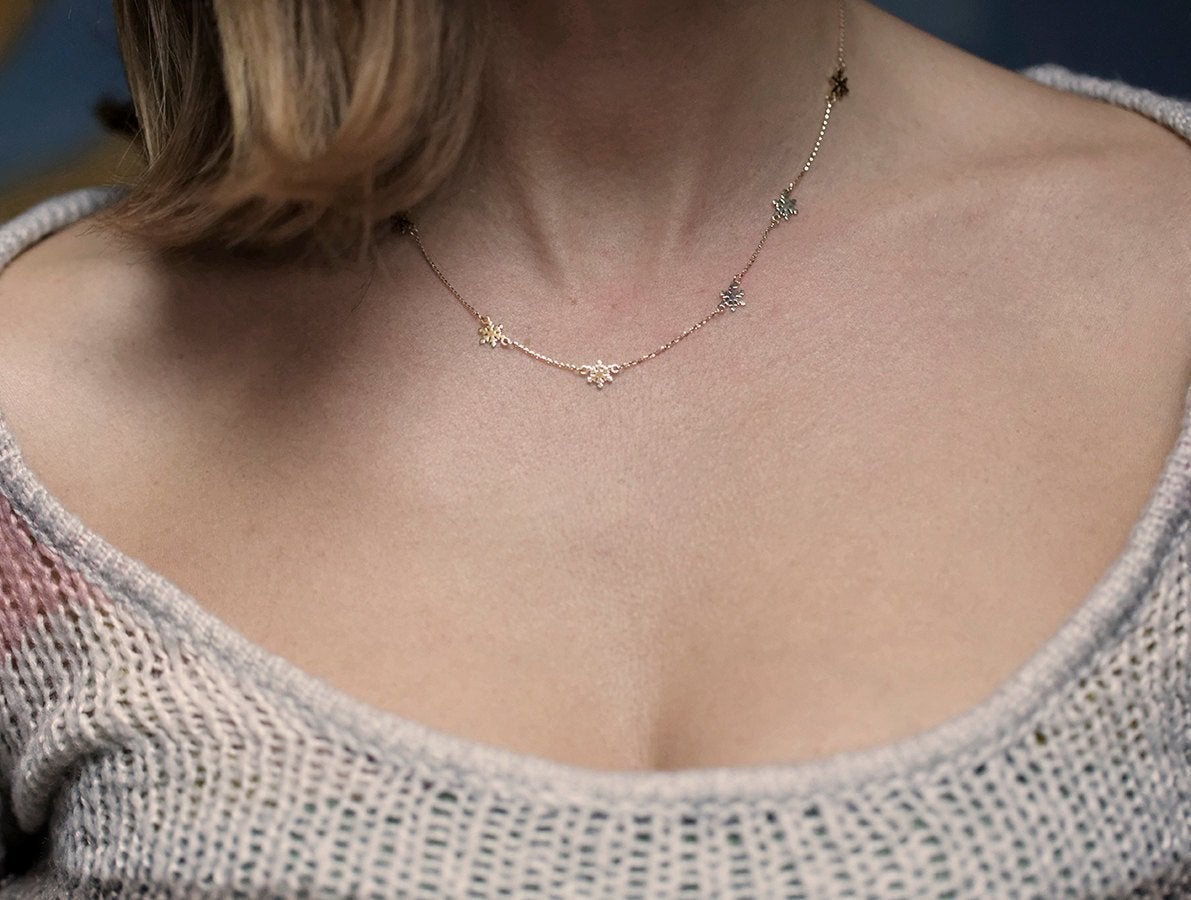 Gold snowflake station necklace