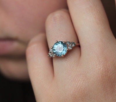 Round blue sapphire ring with side diamonds