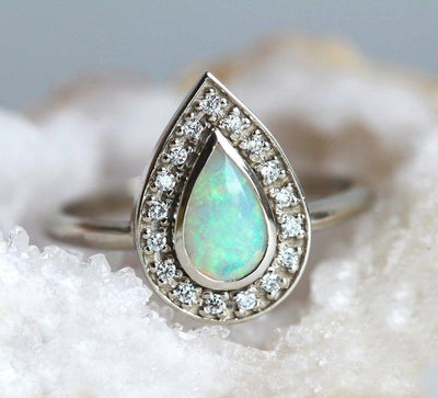 White Pear Opal Halo White Gold Ring with Round White Diamonds Surrounding The Main Gemstone