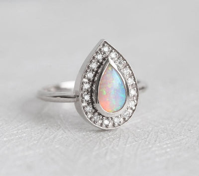 White Pear Opal Halo White Gold Ring with Round White Diamonds Surrounding The Main Gemstone