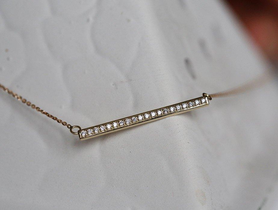 Gold bar necklace with white diamond pave