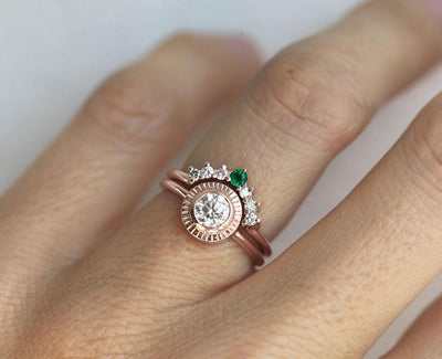 Round Diamond Engagement Ring Set Combined with curved ring featuring a Round Emerald and Side White Diamonds