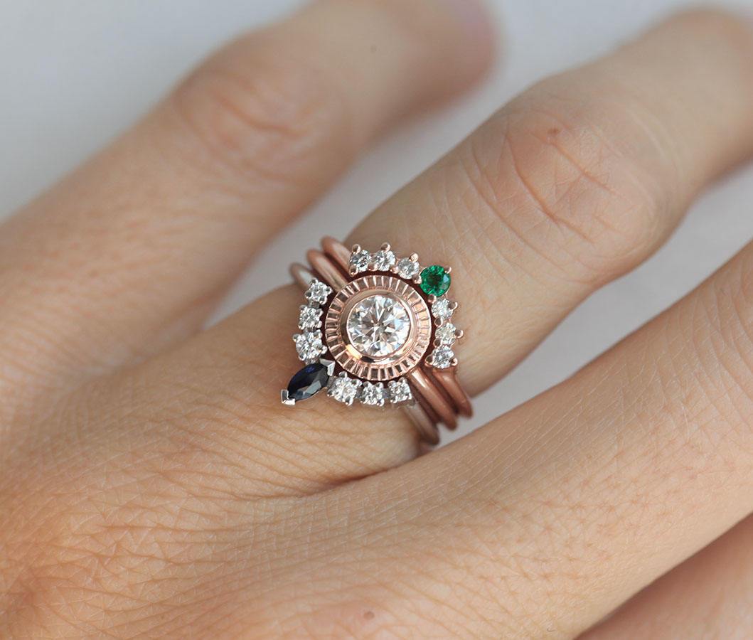 Round Diamond Engagement Ring Set Combined with curved ring featuring a Round Emerald and Side White Diamonds