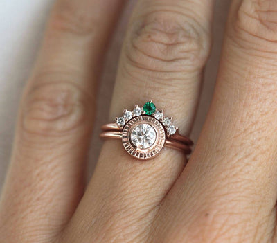 Round Diamond Engagement Ring Set Combined with curved ring featuring a Round Emerald and Side White Diamonds