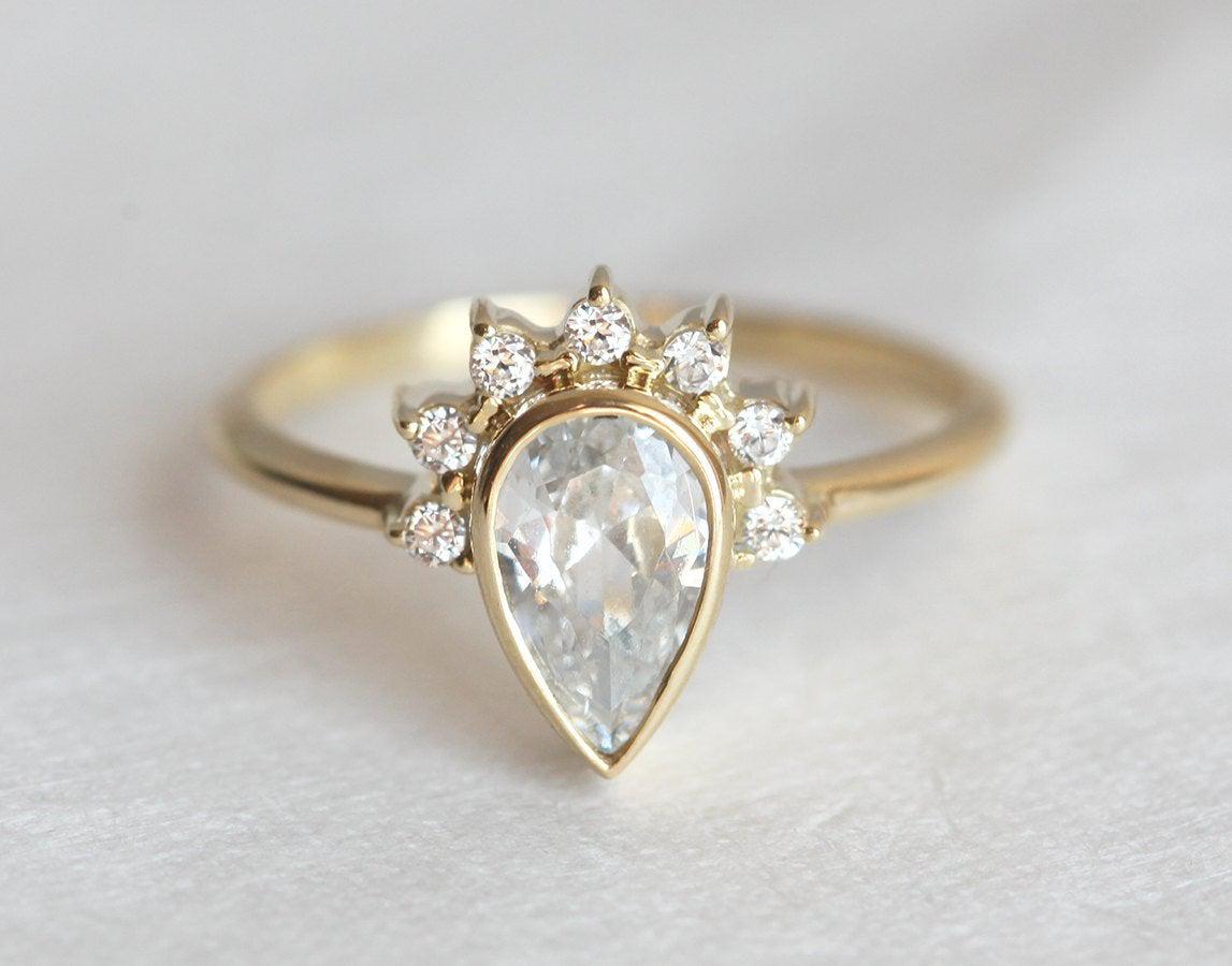 Pear White Diamond Halo Engagement Ring with Side White Diamonds