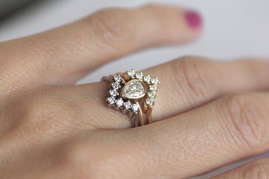 Centerpiece Pear Diamond Engagement Ring with Matching Chevron Diamond Rings making up a set