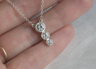 Gold chain necklace with round diamond cluster