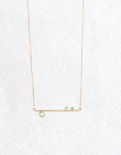 Gold bar necklace with round opal, diamond and emerald gemstones 