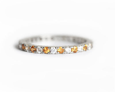 Diamond and orange sapphire eternity ring