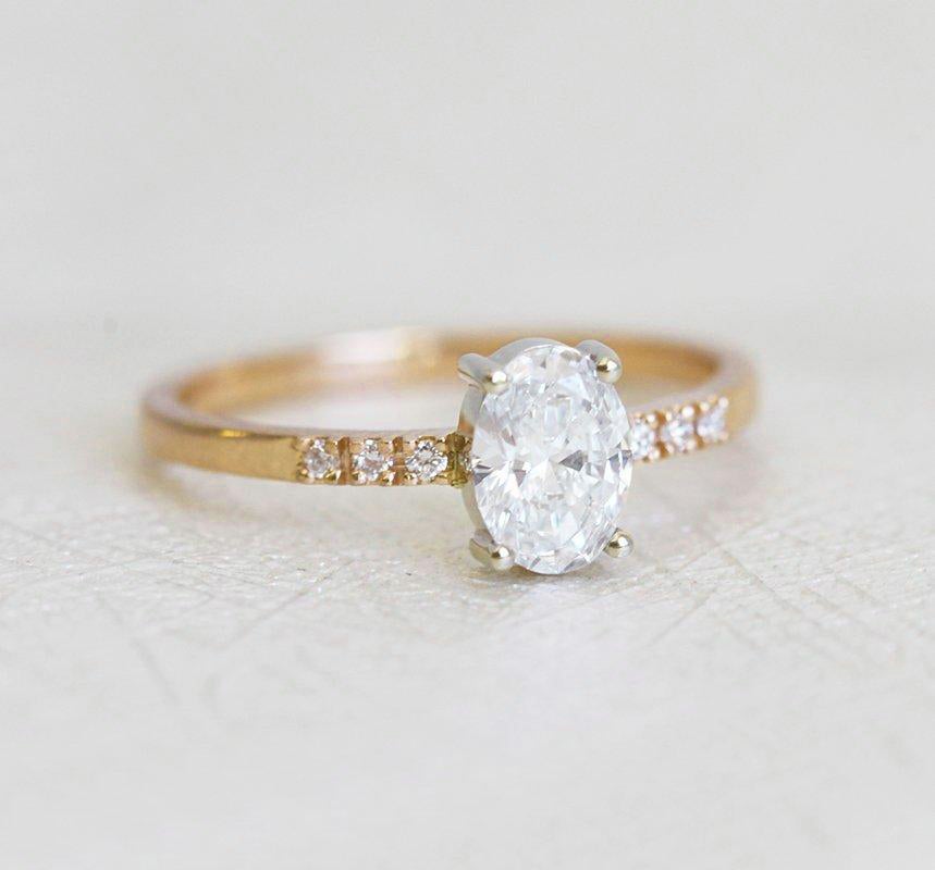 Oval White Diamond Ring with Pave-embellished gold band