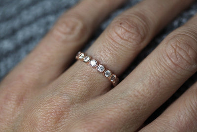 Round White Diamonds Scalloped in an Eternity Wedding Band