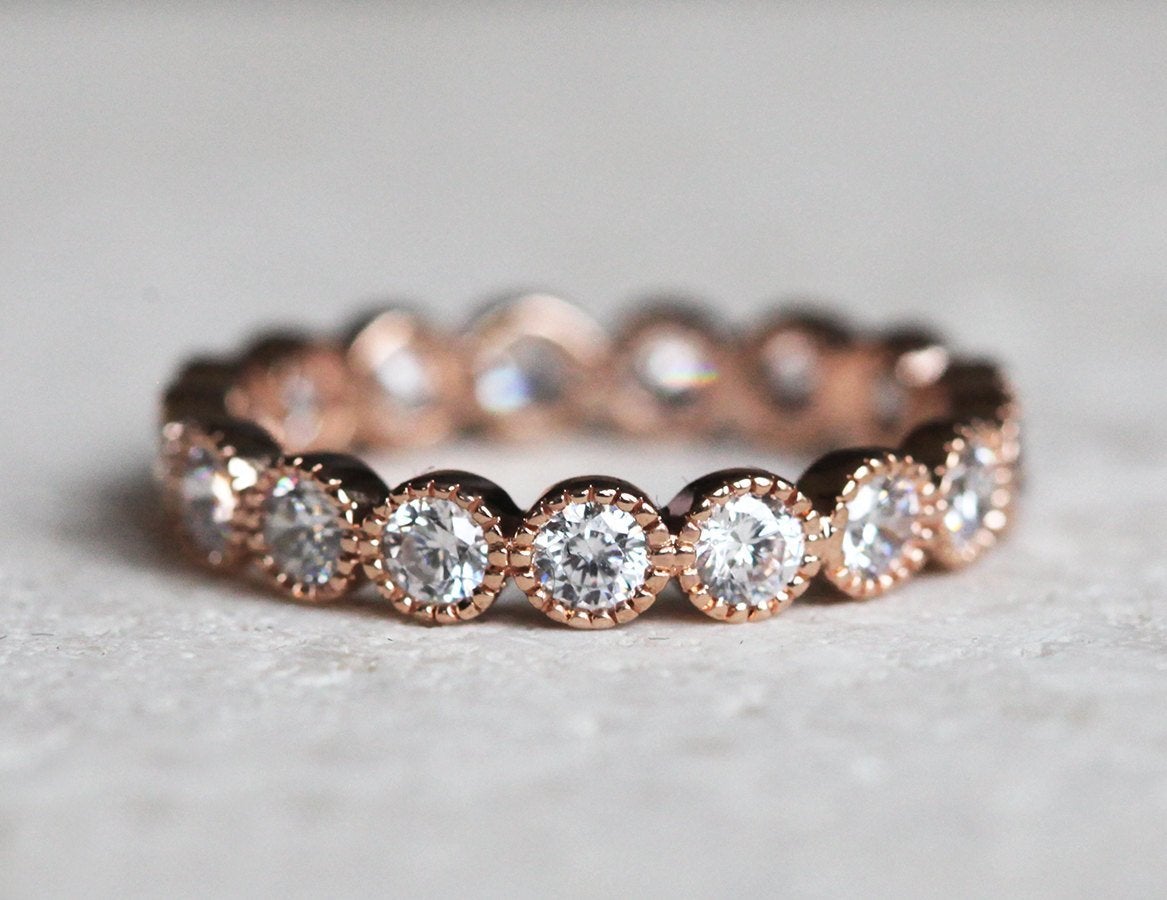 Round White Diamonds Scalloped in an Eternity Wedding Band