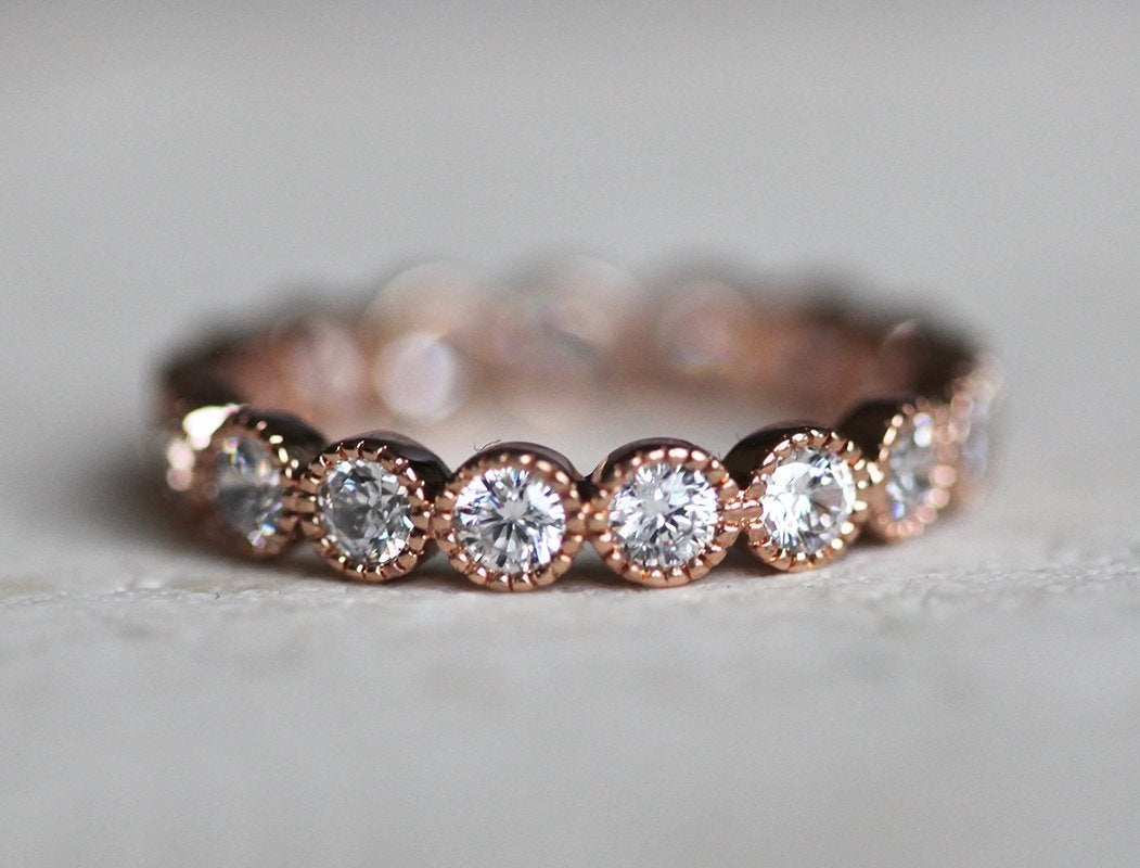 Round White Diamonds Scalloped in an Eternity Wedding Band