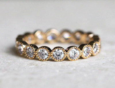 Round White Diamonds Scalloped in an Eternity Wedding Band