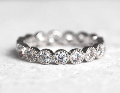 Round White Diamonds Scalloped in an Eternity Wedding Band