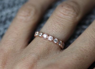 Round White Diamonds Scalloped in an Eternity Wedding Band