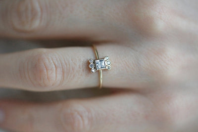 Princess Cut White Diamond Ring with Round White Side Diamonds