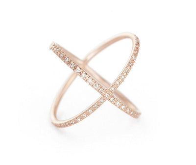 A unique X bar wide ring with pave set diamonds