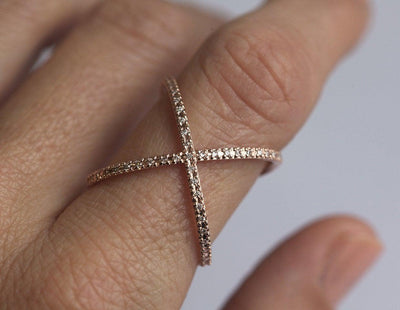 A unique X bar wide ring with pave set diamonds