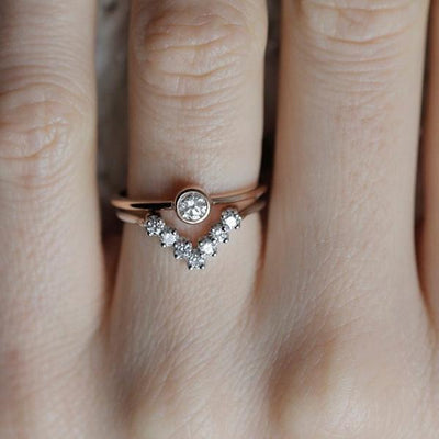 Round White Diamond Solitaire Ring along with a V-Shaped White Diamond Ring