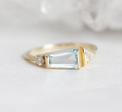 Trapezoid-Cut Light Blue Aquamarine Cluster Ring with one Triangle-Cut White Diamond and a Round White Diamond